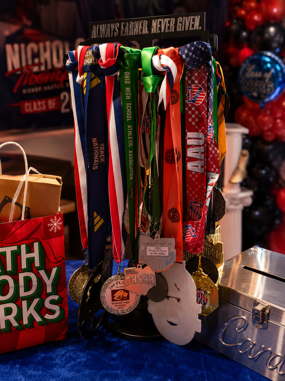 Always Earned. Never Given. — Medal Tower — Graduation event by Good Time Mascots