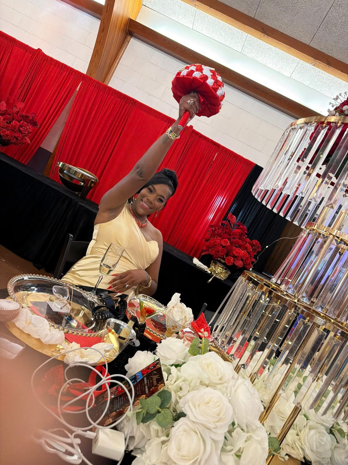 Bouquet raised above a crystal chandelier centerpiece — Weddings by Good Time Mascots in Columbus, Ohio