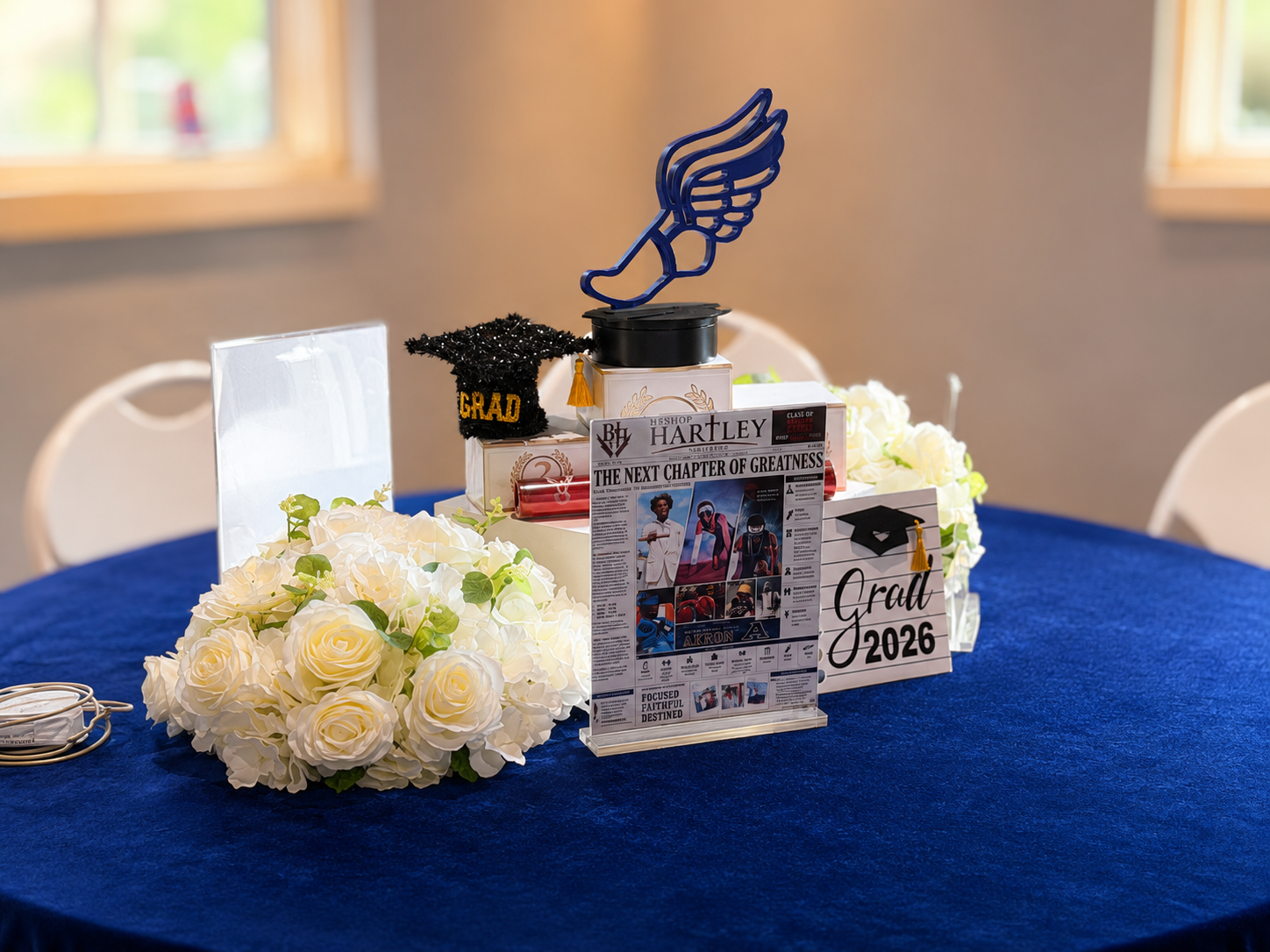 Ivory Rose & Track Trophy Tablescape — Graduation event by Good Time Mascots