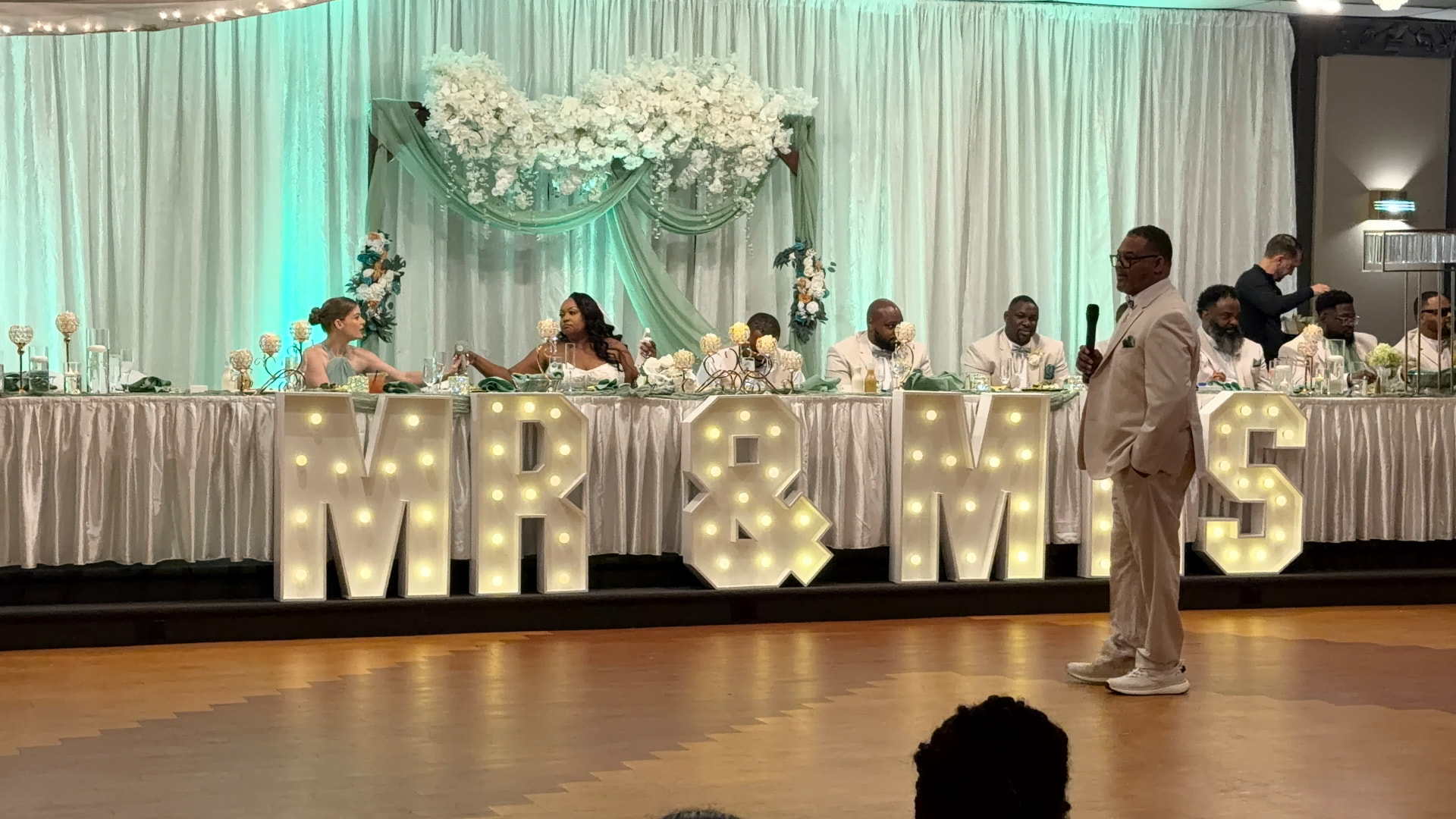 Head table beneath illuminated marquee letters — Weddings by Good Time Mascots in Columbus, Ohio