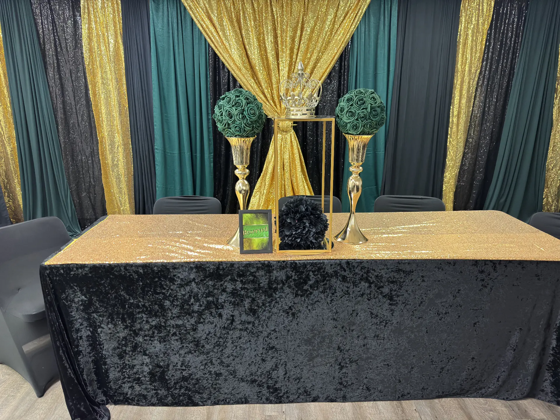 Black, emerald and gold sequin head table with a crown focal piece — Church & Community Events by Good Time Mascots in Columbus, Ohio