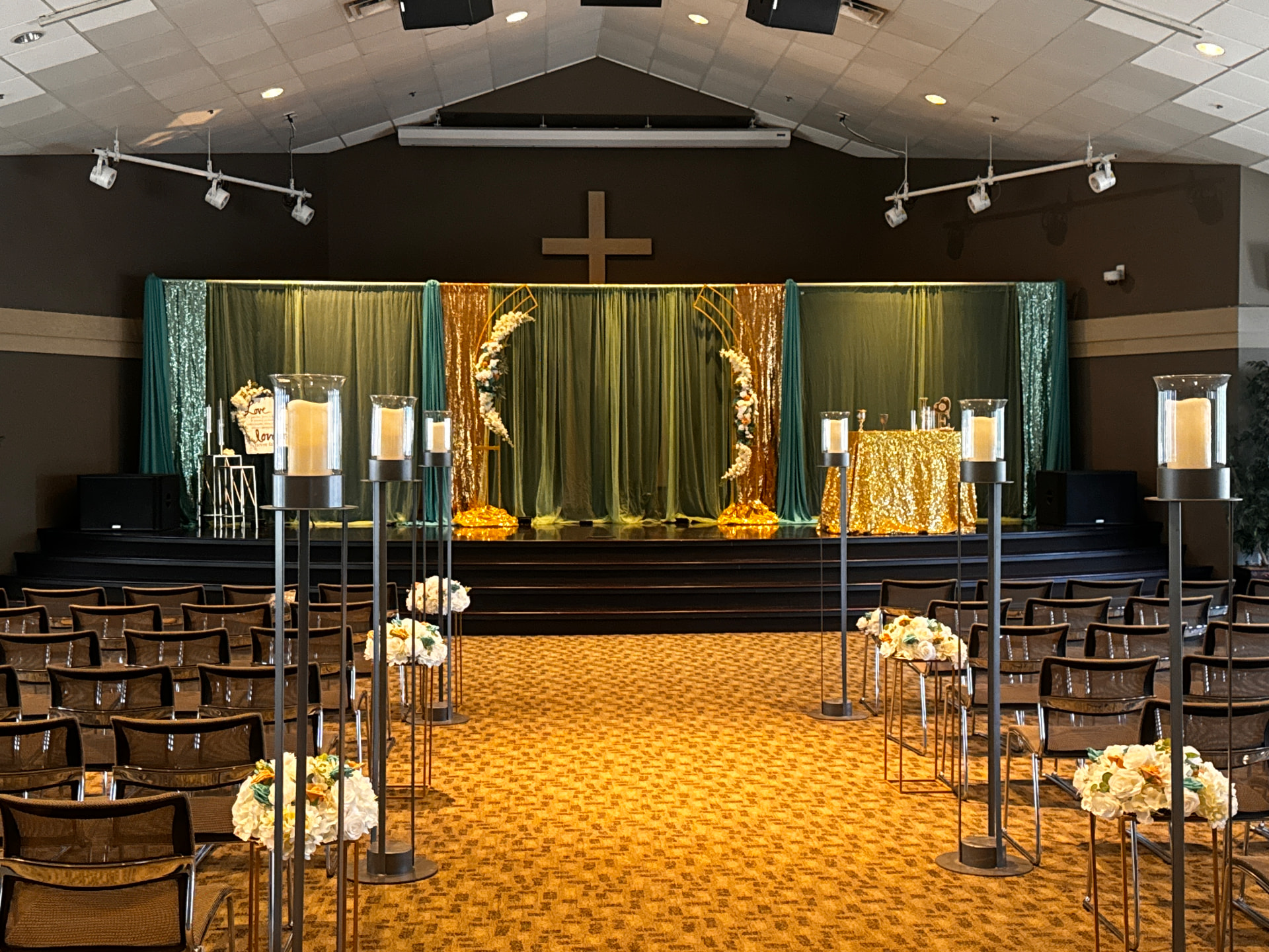 Ceremony aisle lined with pillar candles and floral clusters — Weddings by Good Time Mascots in Columbus, Ohio