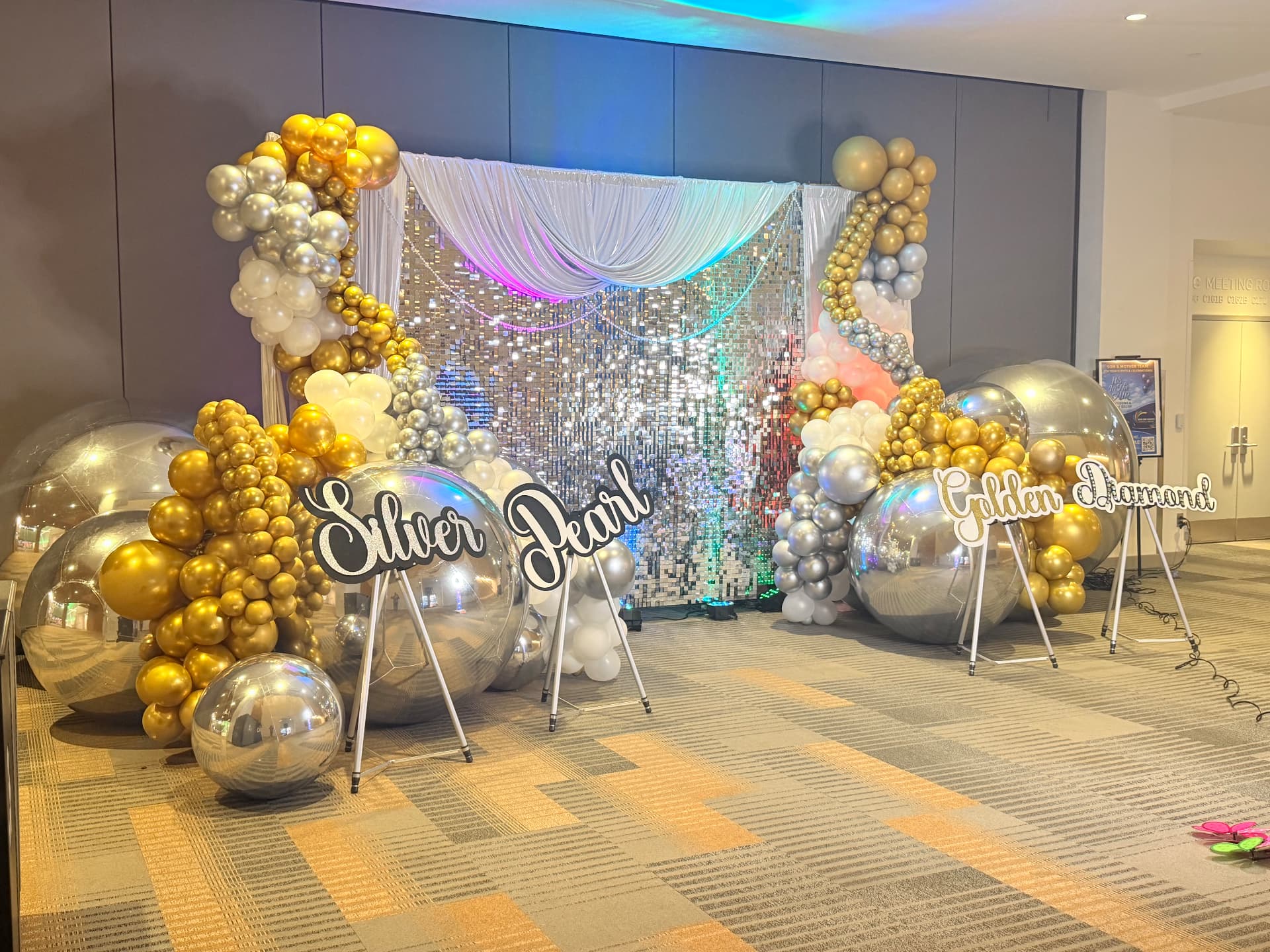 Silver, pearl & golden garland clusters with oversized chrome spheres — Balloon Décor by Good Time Mascots in Columbus, Ohio
