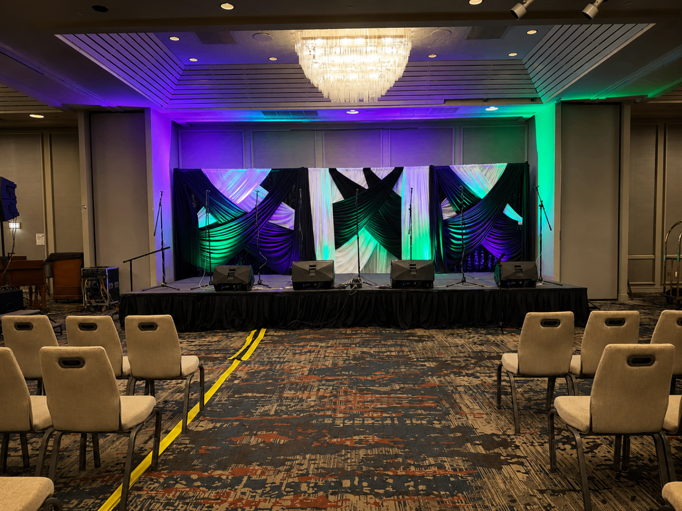 Triptych Uplit Stage Drape — Draping event by Good Time Mascots