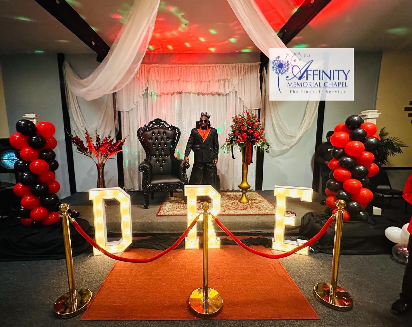 Throne and marquee-letter tribute with red carpet and balloon columns — Celebration of Life & Memorials by Good Time Mascots in Columbus, Ohio
