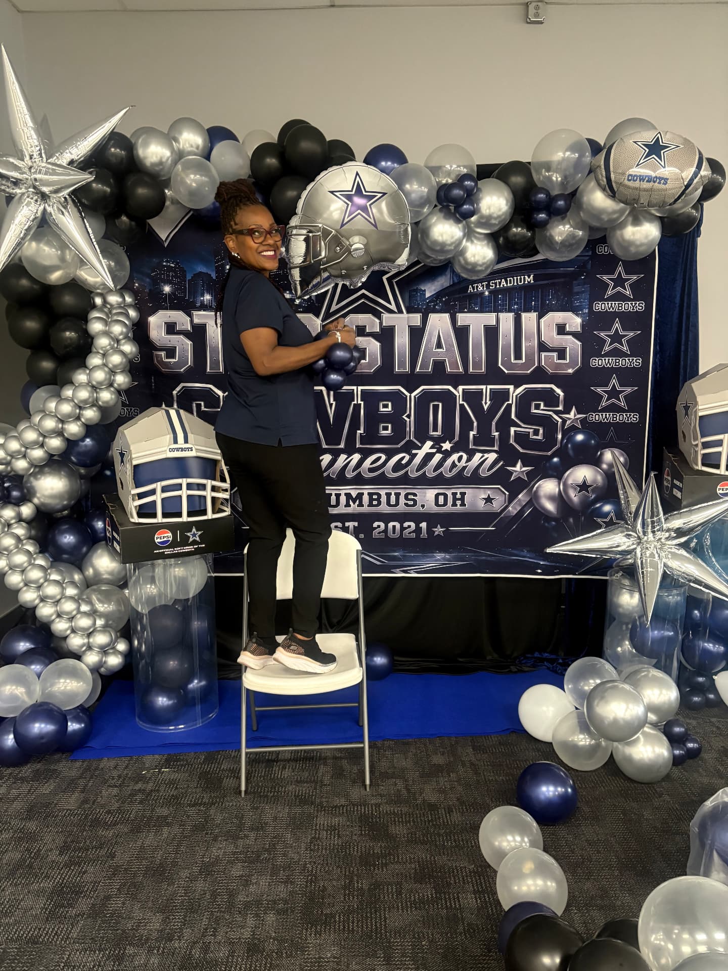 Team-themed backdrop, skyline banner and balloon columns built for a Columbus football party — Custom Graphics & Signage by Good Time Mascots in Columbus, Ohio